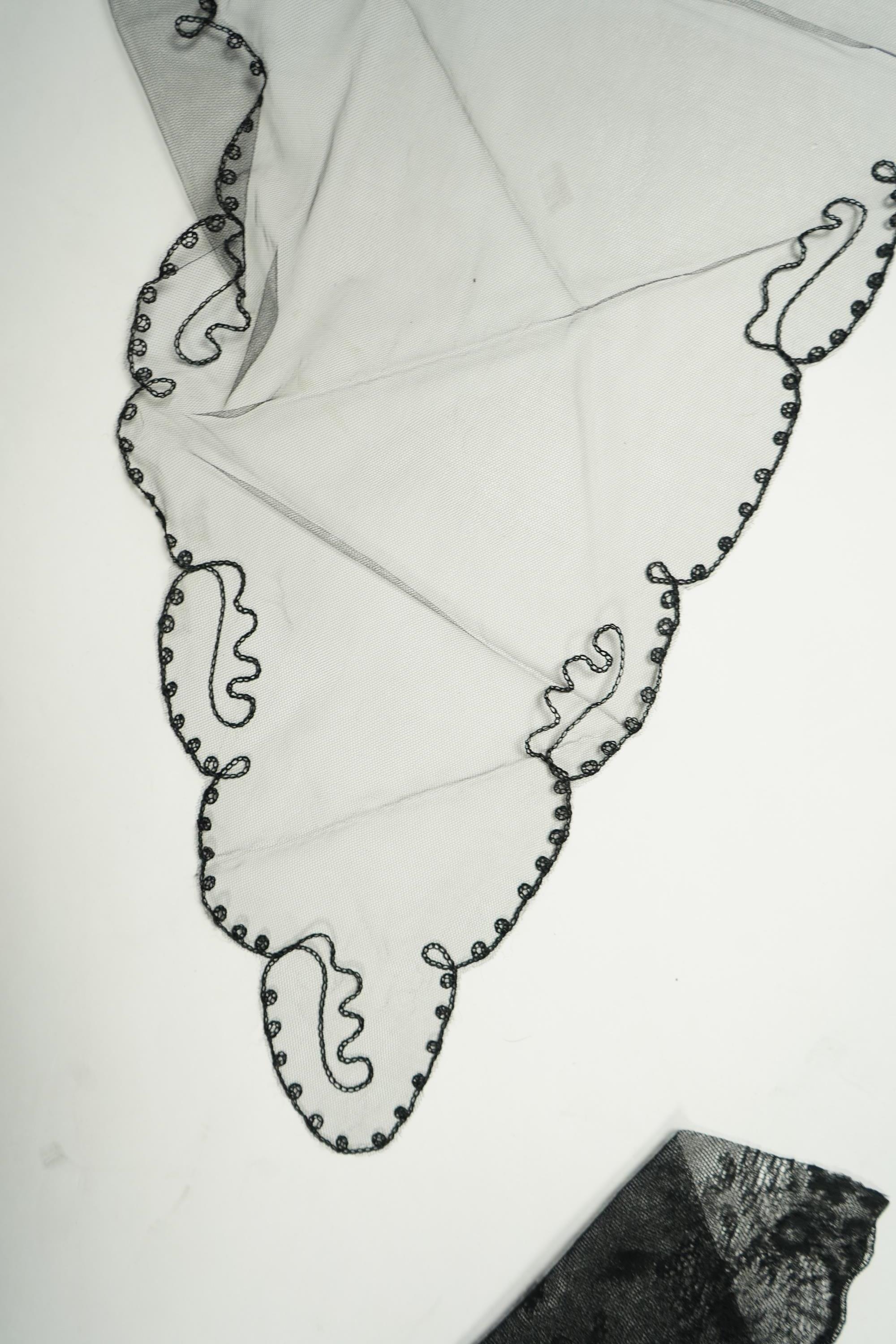 A fine cream and black silk ‘tatting’ stole, two black silk stoles, two bonnet veils and various collars and small triangular mantilla etc. Condition - some damage to bonnet veil., Tatting stole 184cm long.